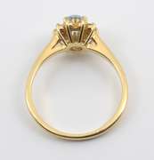 Feminine Blue Topaz and Diamond Ring
