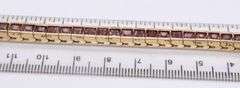Attractive Yellow Gold Garnet Channel Set Bracelet