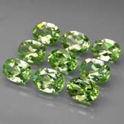 Dazzling 7.61ct untreated apple green Peridot set