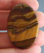 Dramatic 82.65ct Tiger Eye cabochon