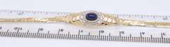 Lovely Yellow Gold Cab Oval Sapphire and Diamond Halo Bracelet