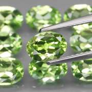 Dazzling 7.61ct untreated apple green Peridot set