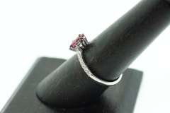 Exotic Crimson Ruby Halo Ring flanked with Diamonds on an 18k White Gold Band