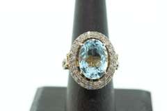 Gentle Blue Topaz Ring with Gold Plated Silver and Diamond Accents