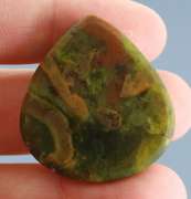 Beautiful 59.80ct green Opal and matrix cabochon