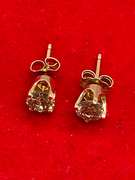 LADIES 14K GOLD AND DIAMOND STUDS.