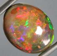 Magnificent 4.70ct full body flashing Semi Black Opal