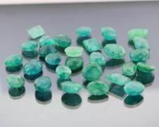 Heavy 230.50ct collection of Emeralds