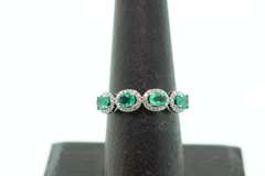 Mesmerizing Four-Stone Emerald 18k White Gold Ring edged with Diamonds