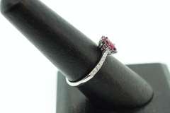Exotic Crimson Ruby Halo Ring flanked with Diamonds on an 18k White Gold Band