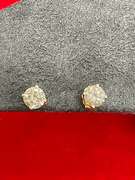 LADIES 14K GOLD AND DIAMOND STUDS.
