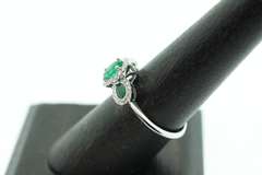 Beautiful Three-Stone Emerald 18k White Gold Ring edged with Sparkling Diamonds