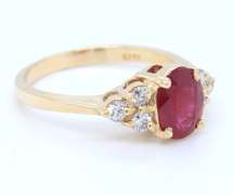 Pleasing Yellow Gold Oval Ruby and Diamond Ring