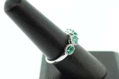 Mesmerizing Four-Stone Emerald 18k White Gold Ring edged with Diamonds