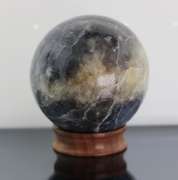 Tremendous 1,378ct sphere cut galaxy patterned Iolite