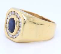 Handsome Yellow Gold oval Sapphire and Diamond Channel Halo Ring