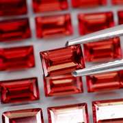 Nice 9.78ct emerald cut cherry red Garnet set