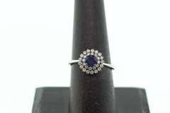 18k White Gold Sapphire Halo Ring surrounded with Diamonds