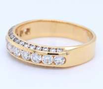 Elegant Yellow Gold 2.55ctw Channel Set Diamond Band