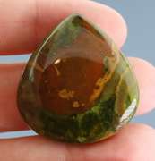 Beautiful 59.80ct green Opal and matrix cabochon