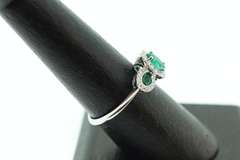 Beautiful Three-Stone Emerald 18k White Gold Ring edged with Sparkling Diamonds