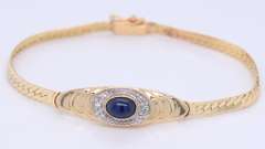 Lovely Yellow Gold Cab Oval Sapphire and Diamond Halo Bracelet