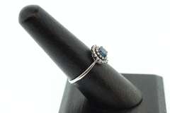 18k White Gold Sapphire Halo Ring surrounded with Diamonds