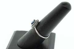 18k White Gold Sapphire Halo Ring surrounded with Diamonds