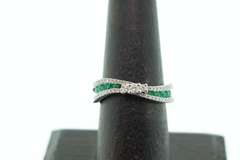 Flowing Channel Set 18k White Gold Emerald and Diamond Ring with Triple-Stone Center
