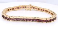 Attractive Yellow Gold Garnet Channel Set Bracelet
