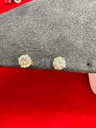 LADIES 14K GOLD AND DIAMOND STUDS.