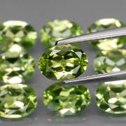 Dazzling 7.40ct untreated apple green Peridot set
