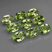 Dazzling 7.40ct untreated apple green Peridot set
