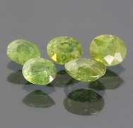 Eye catching 3.70ct untreated Demantoid Garnet set