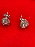 LADIES 14K GOLD AND DIAMOND STUDS.