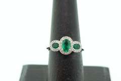 Beautiful Three-Stone Emerald 18k White Gold Ring edged with Sparkling Diamonds