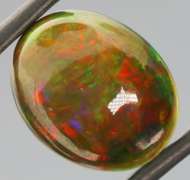 Magnificent 4.70ct full body flashing Semi Black Opal