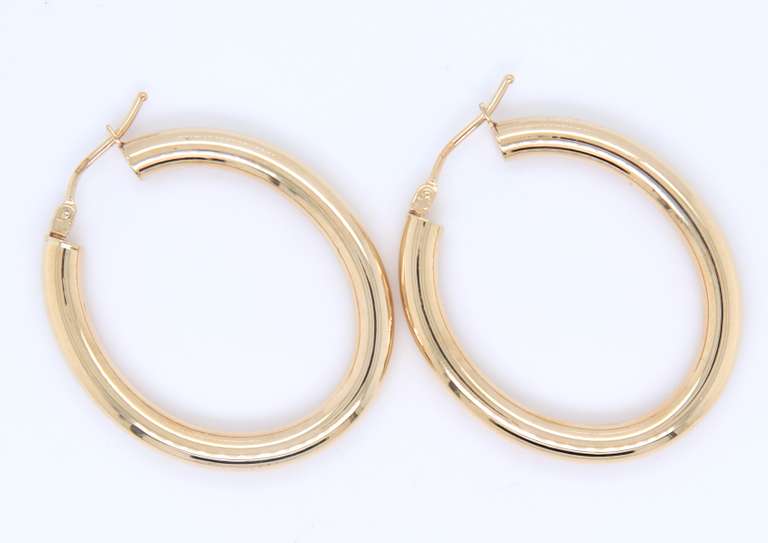 Beautiful Yellow Gold oval Tube Hoop Earrings