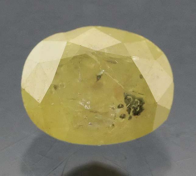 Eye catching .57ct oval cut yellow Diamond