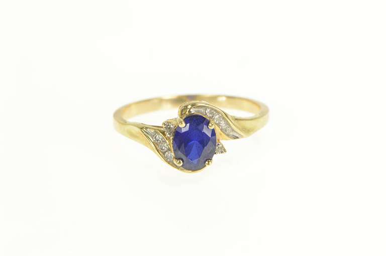 10K Yellow Gold Oval Syn. Sapphire Diamond Cluster Bypass Ring