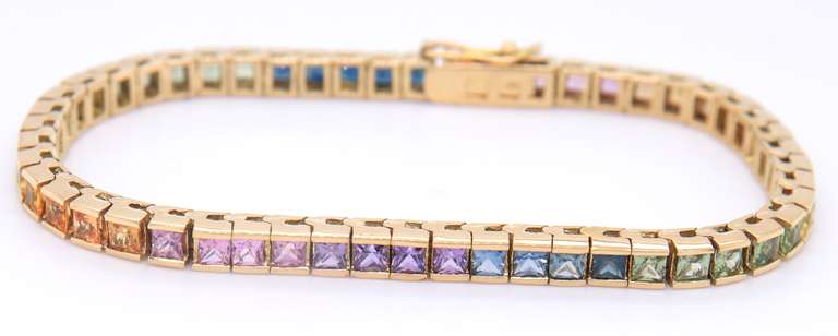 Attractive Yellow Gold approximate 10.20ctw Multi Color Sapphire Channel Set Bracelet