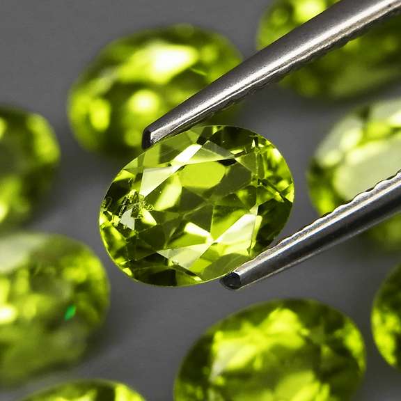 Dazzling 7.53ct untreated apple green Peridot set
