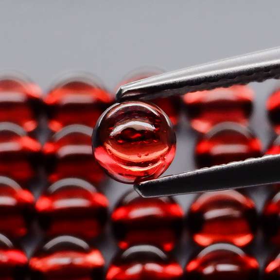 Incredible 8.96ct open color Mozambique Garnet cabochon set