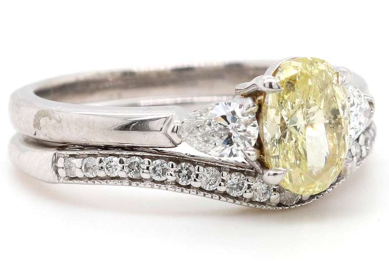 1.18ct Oval Fancy Intense Yellow and 0.40ctw Pear White Diamond Three Stone Bridal Set in 18K