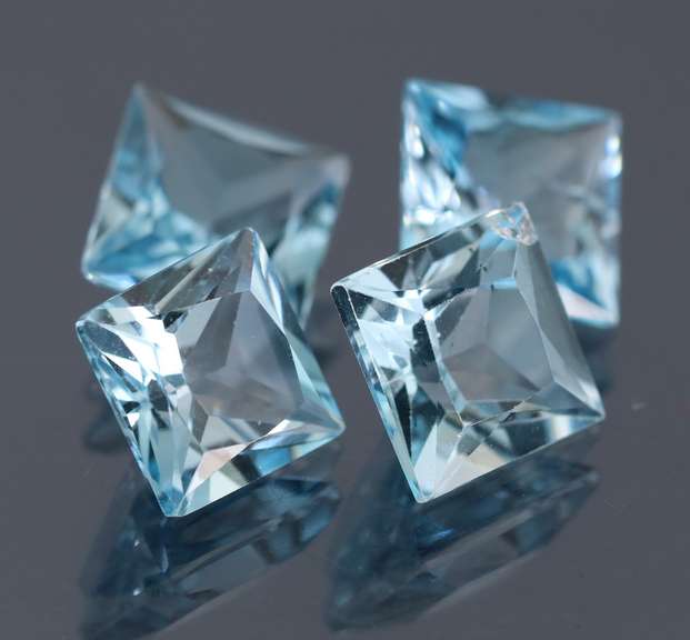 4 piece 21.92ct glittering sky blue Topaz set