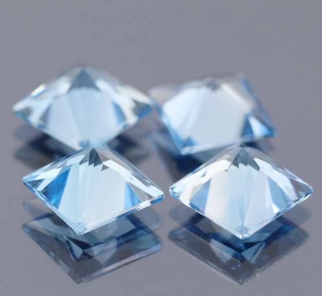 Vivid! 21.21ct radiant cut Swiss blue Topaz set
