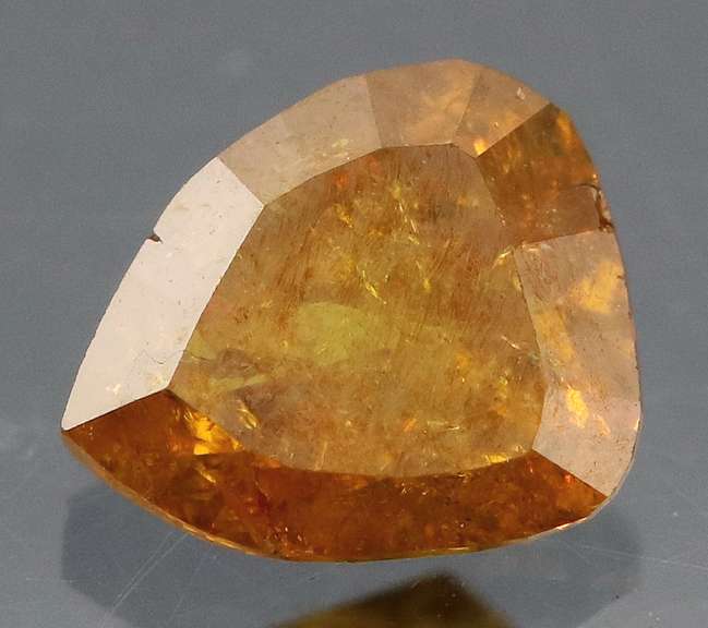 Stunning .56ct pear cut red orange Diamond