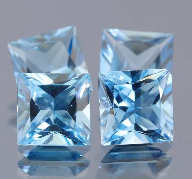 Vivid! 21.21ct radiant cut Swiss blue Topaz set