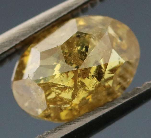 Incredible .69ct oval cut golden Diamond