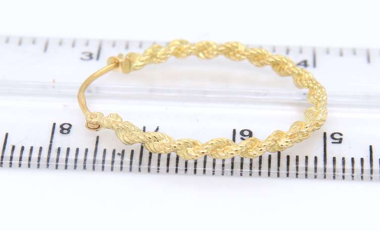Charming Yellow Gold Twisted Hoop Earrings